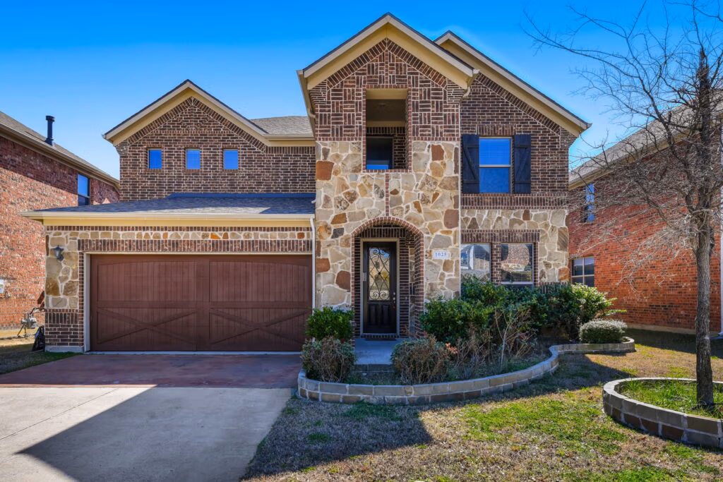 1025 Chickasaw Dr, Carrollton, TX 75010 Two-story brick home at 1025 Chickasaw Dr, Carrollton, TX 75010