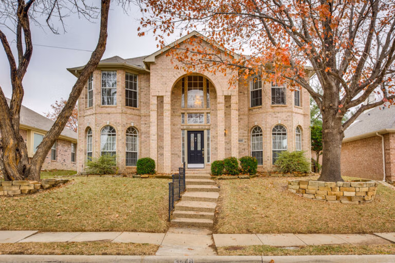 3448 Lark Meadow Way, Dallas, TX 75287 Front yard and two-story brick home at 3448 Lark Meadow Way, Dallas, TX 75287